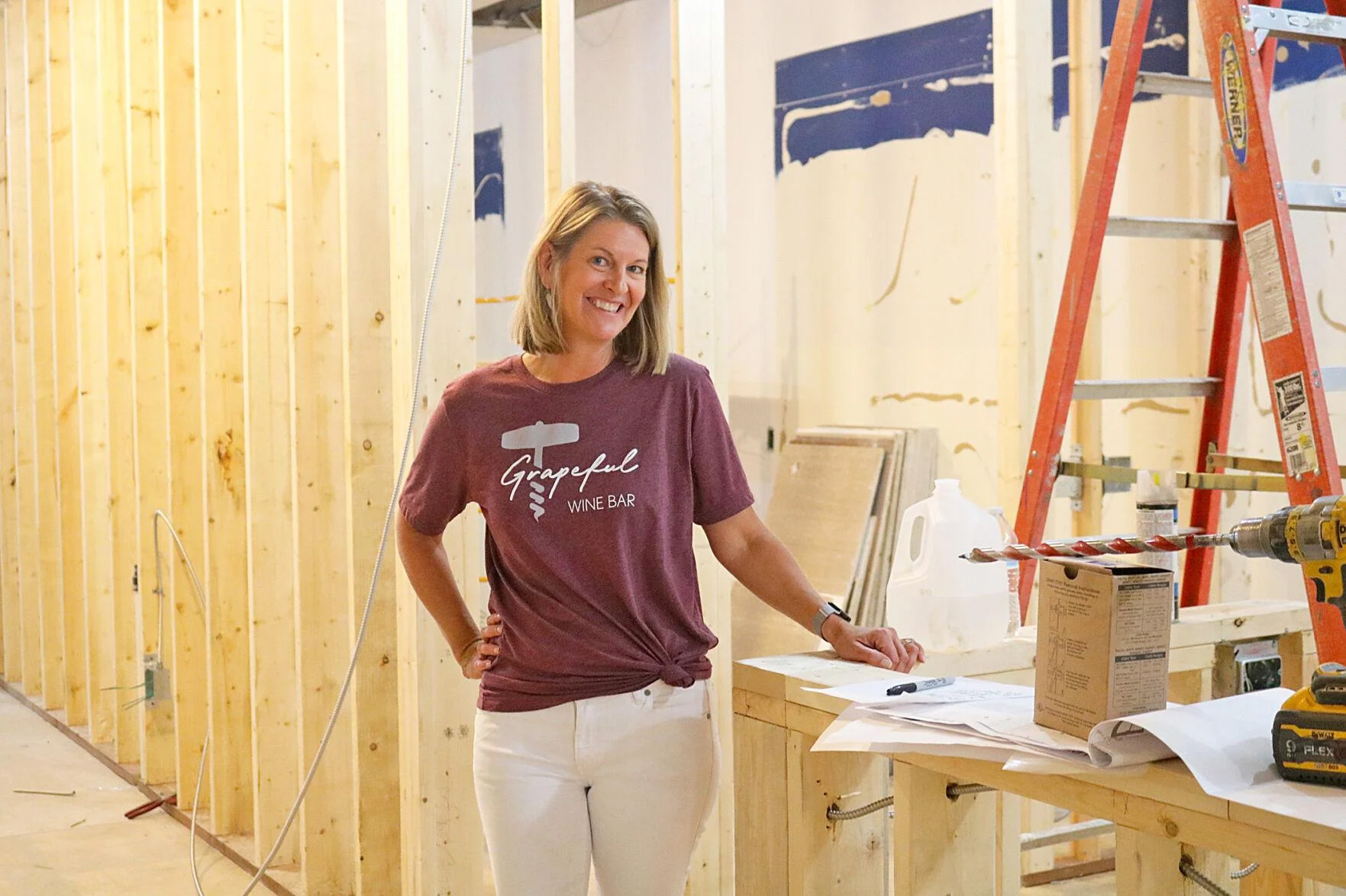 Stacy Hanson shows off the future bar and small kitchen area in Grapeful, which she says will bring a vineyard vibe to Owatonna. (Annie Harman/southernminn.com)